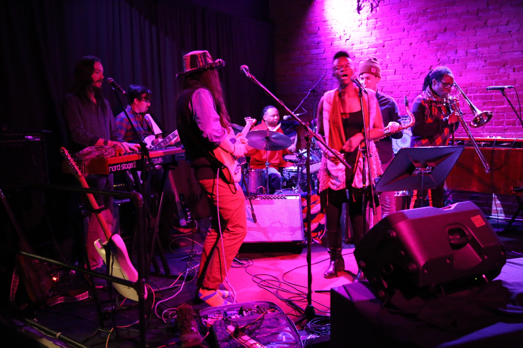 The full B Love band performing on stage