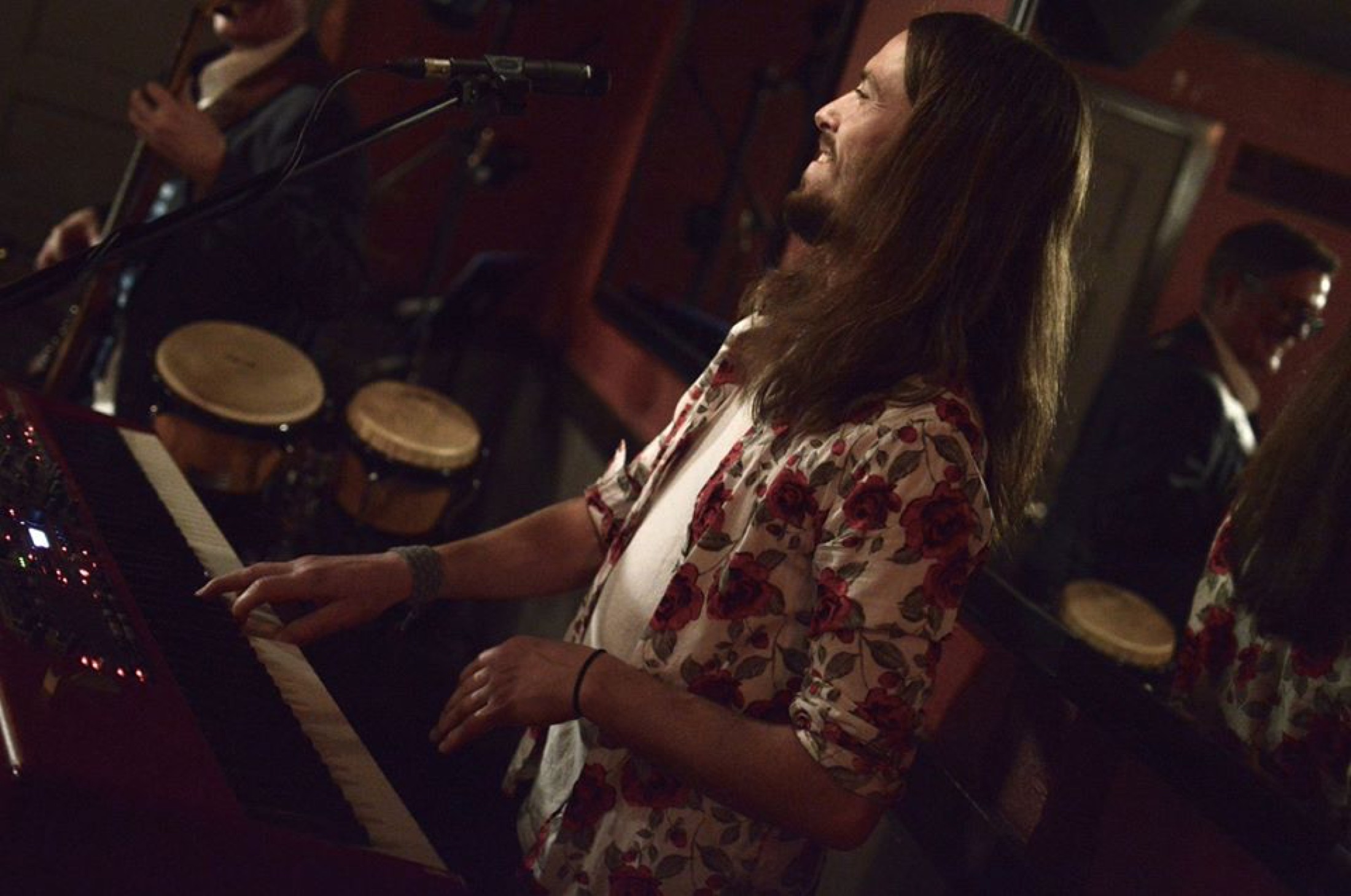 B Love keyboard player performing